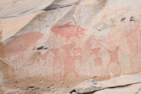 ancient pre-historic paint symbol on rock in thailandの写真素材
