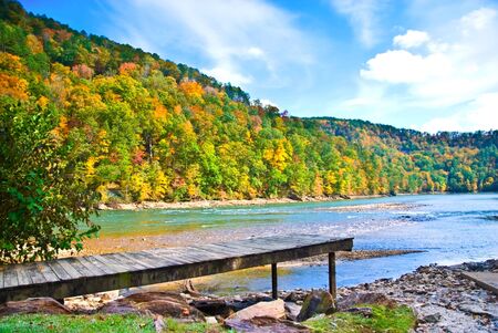 A dock surrounded by rocks. This is Lake Yonah in north Georgia during the autumn when they lower the lake level.の写真素材