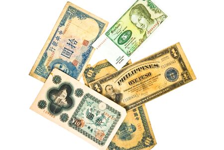 A collection of old paper currency. Philippines circa 1922; Germany 5 Deutsche Mark 1980 Federal Rep; Ten Yuan; Central Bank of China, Ten Yuan cira 1942; Ten Yen Banknote, 1946.の写真素材