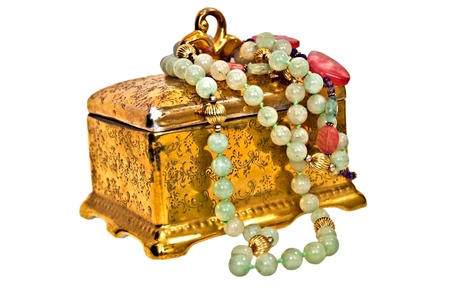 An antique, 24 karat gold, porcelain box with natrual stone necklaces.の写真素材