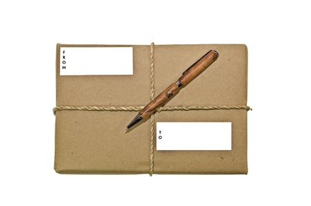 A package wrapped for delivery with twine and a pen.の写真素材