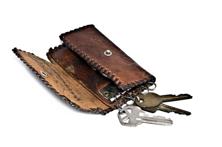 An old handmade leather wallet for keys. の写真素材