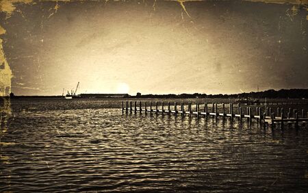 An antique style photo of a pier in the evening.のeditorial素材