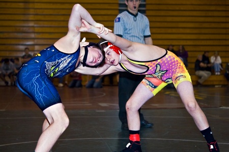 GAINESVILLE, GA, USA - February 11, 2012: Two young boys in the 11-14 division wrestling during tournament at North Hall High School in Gainesville, GA.のeditorial素材
