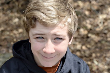 A teenage boy portrait outdoors.の写真素材