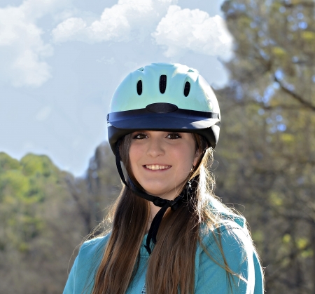 A beautiful young teenaged girl ready for a horseback ride の写真素材