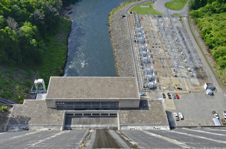 A view down onto the power plant and river at Fontana Dam   The Fontana Dam is the highest dam east of the Rocky Mountains  Towering 480 feet in height, the dam backs water for 30 miles and is a major source of energy for the Tennessee Valley の写真素材