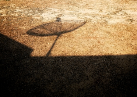 shadow of satellite dish on the ground