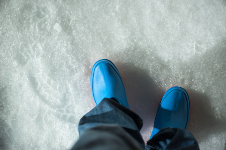Rubber boots or take a walk on the snow.の写真素材