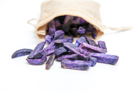 Purple potato chips, on a white background.の写真素材