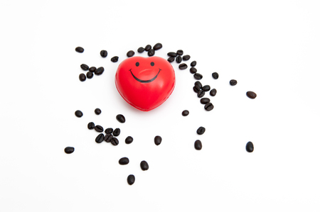 Coffee beans and red heartsの写真素材