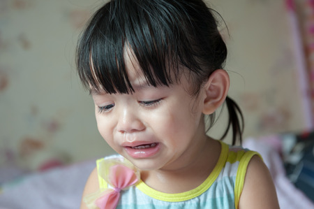 Little girl crying and sad.の写真素材
