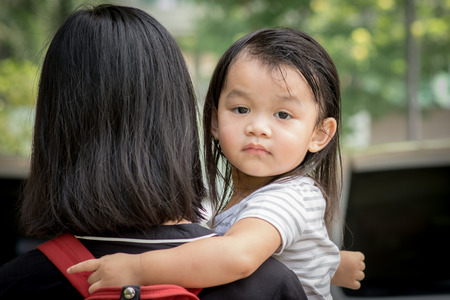 Mother and daughter, daughter turned to look back.の写真素材
