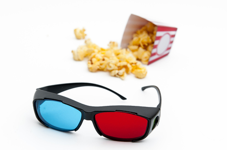Popcorn and 3D glasses, to see the 3D movie on a white background.の写真素材