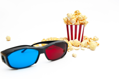 Popcorn and 3D glasses, to see the 3D movie on a white background.の写真素材