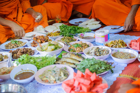 Food offerings to the Buddha, merit raising in Thailand.の写真素材