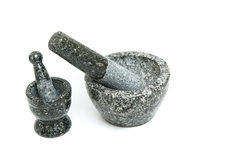 Mortar stone, black for pound on white background.の写真素材