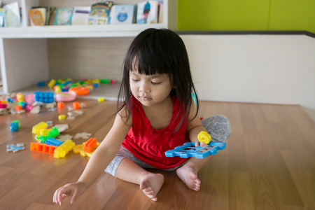 Asian little girl, playing toysの写真素材