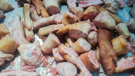 Raw pork legs sold in the market.の写真素材
