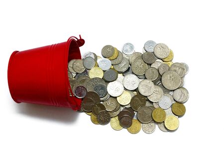 Coins and bucket over white backgroundの素材