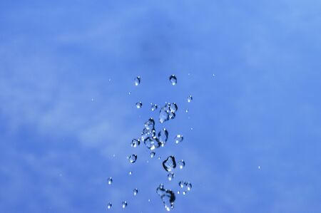 water splash over blue sky background
