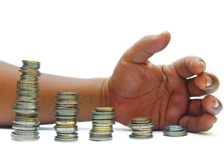 hand and coins over white backgroundの写真素材