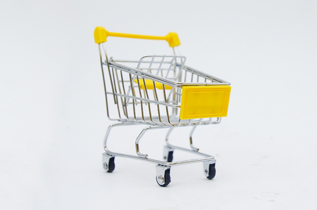empty shopping cart over white backgroundの写真素材