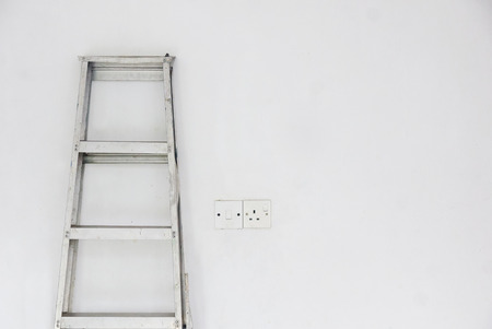 Capacity Platform Step Ladder and plug socket over white backgroundの写真素材
