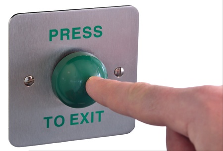 picture of a finger pushing a press to exit button  Shallow depth of field with focus on ther finger...