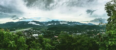 Panoramic view of the city,Town in the valley,City three fogの写真素材