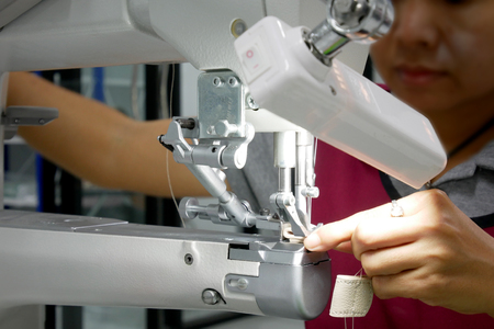Front-side Women are using a sewing machineの写真素材