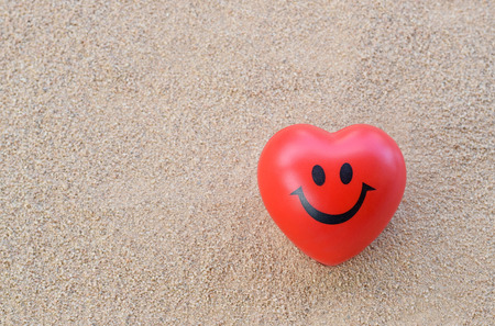 Red one heart on the beachの写真素材