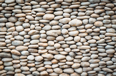 Nature-inspired, the art of decorative white stones on the wall for the garden design.の写真素材