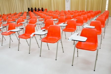 empty classroom and orange chairsの写真素材