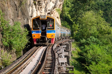Kanchanaburi, Thailand - December 08: The train was traveling through the Death Railway, was built by the Empire of Japan in 1943, to support its forces in the Burma campaign of World War II. on December 08, 2013 in Kanchanaburi, Thailand.のeditorial素材