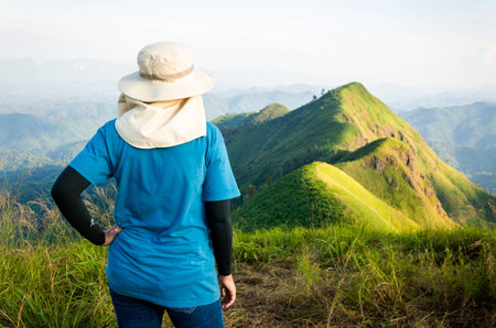 Mountaineer tourists hiking on (Khao Chang Puak) of mountains at Kanchanaburi, Thailand.の写真素材