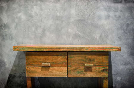 Vintage wooden table with gray wall.の写真素材