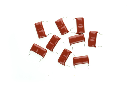 Electronic Parts,Red mylar Capacitor batch isolate on white backgroundの写真素材