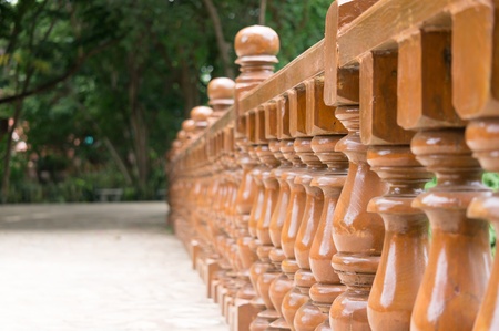 Row wood balustrade in gardenの写真素材