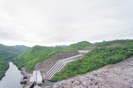 Mountain dam and water flow make electricityの写真素材