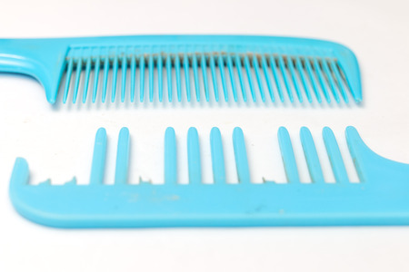 Pair of good and decay comb on white backgroundの写真素材