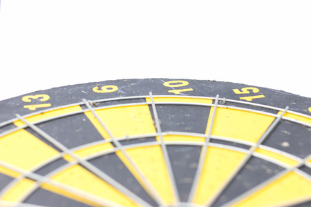 Old black yellow dartboard on white background