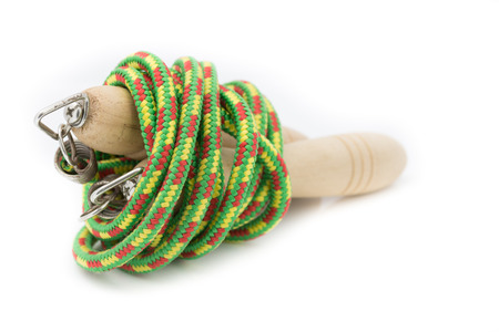 Wood green jump rope on white background