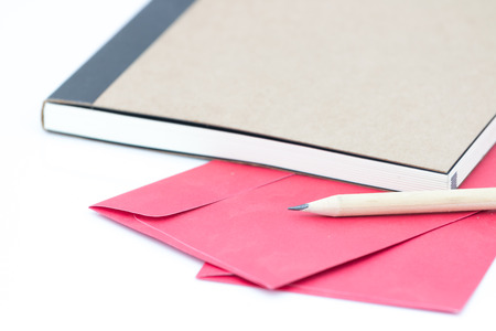 Note book file and pencil on whitebackgroundの写真素材