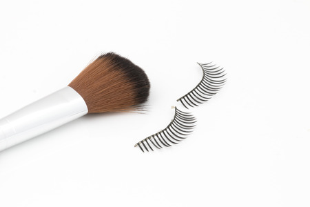 eyelashes and brush isolate on white backgroundの写真素材