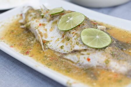 Steam fish in lemon sauceの写真素材