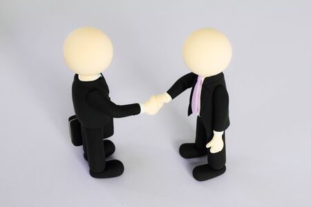 Two businessmen (doll) handshake6の写真素材