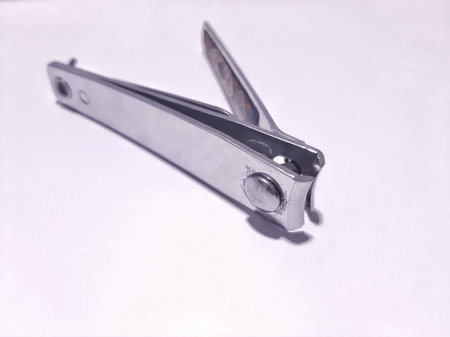 Close up of nail clippers isolated on white background. Self-care tool for nail beauty made of...