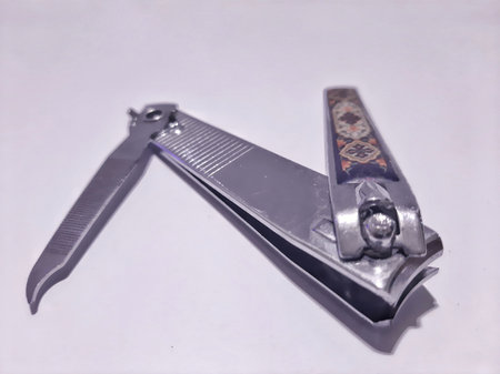 Close up of nail clippers isolated on white background. Self-care tool for nail beauty made of stainless steel. For personal care, hygiene, health and manicure concept.の写真素材