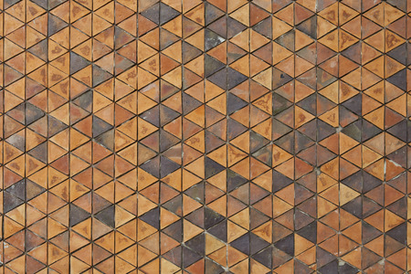 Pattern of triangular clay tiles, honeycomb tile pattern, yellow wallの写真素材